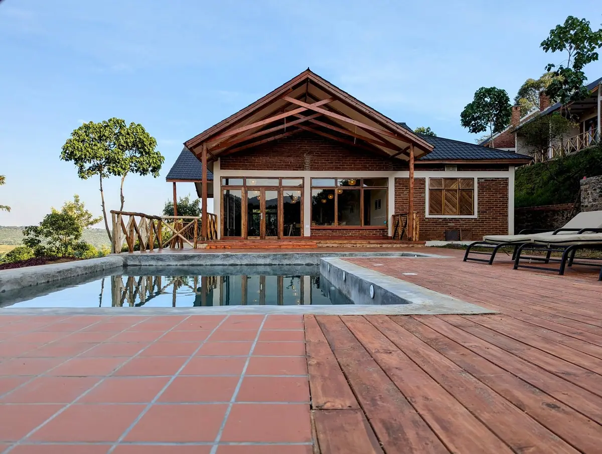 Outdoor pool and lodge building, Mvuli Mountain Lodge