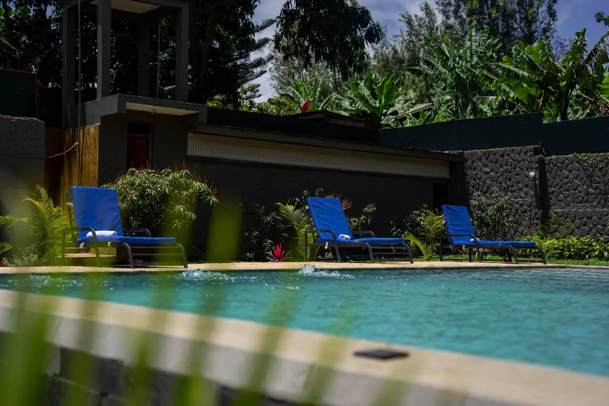 Pool and gardens at Mvuli Farm Lodge