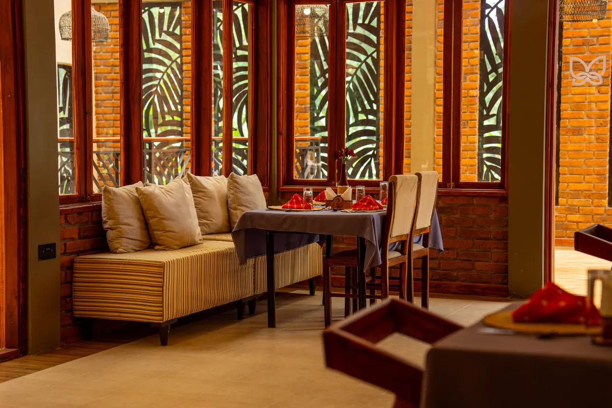 Banquette seating in the restaurant at Mvuli Farm Lodge