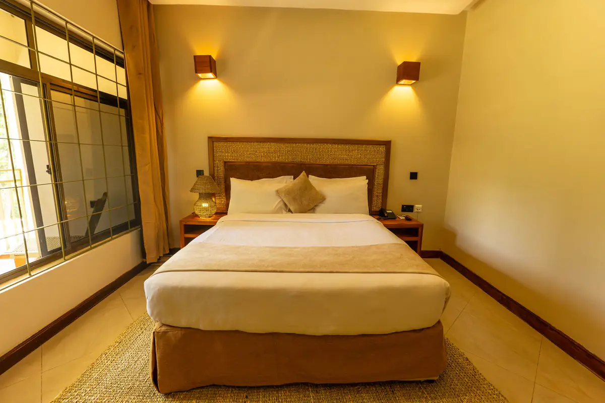 Queen room with reading lights at Mvuli Farm Lodge